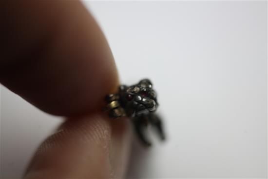 A small Victorian gold and silver, rose cut diamond and cabochon ruby set pug dog brooch, 0.75in.